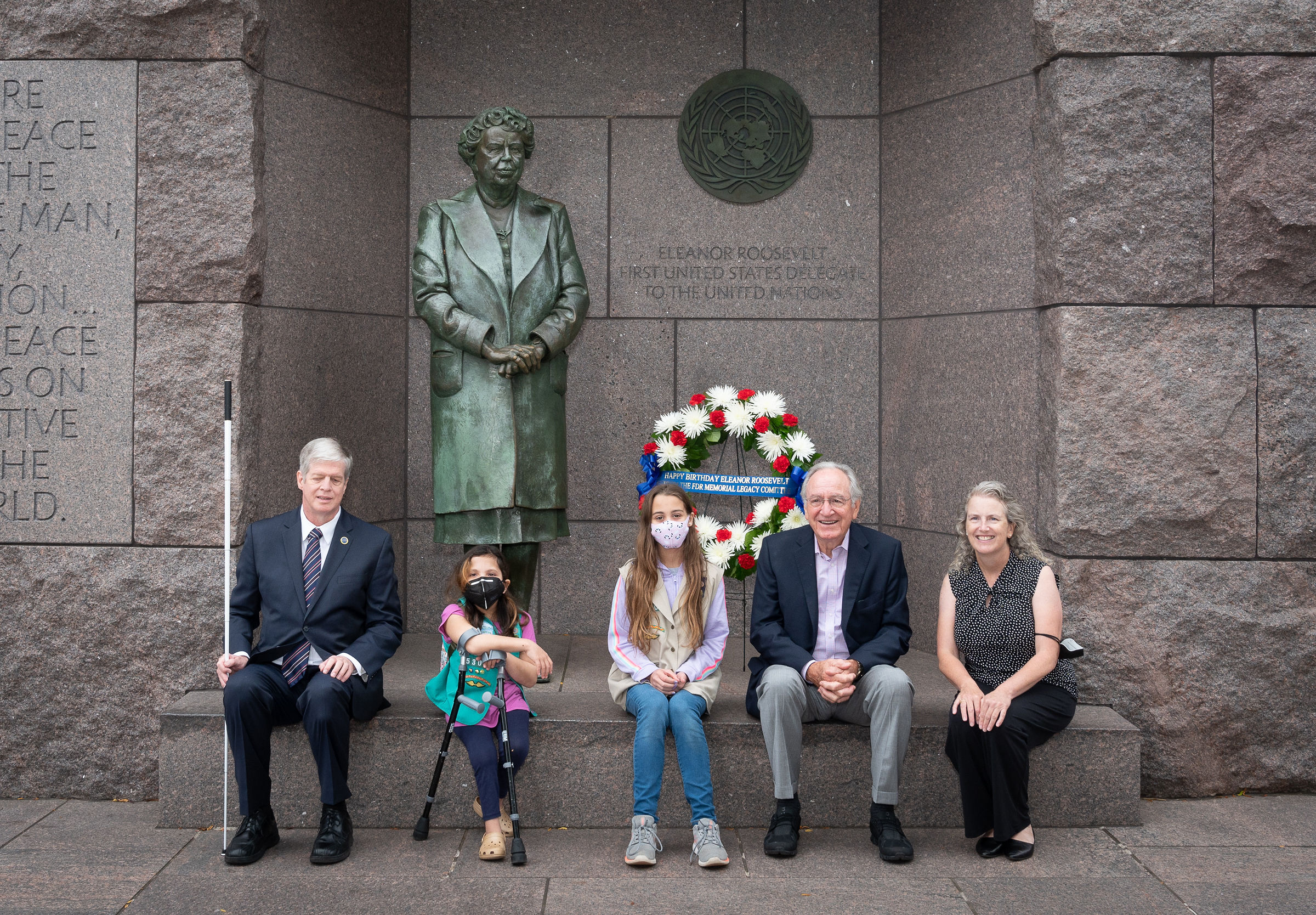 Pictured from left to right: Dr. Kirk Adams, President and CEO of the American Foundation for the Blind (AFB), Ari Paz Pasa, Girl Scout Troop 4720, Eva Lake, Girl Scout Troop 4720, U.S. Senator (Ret) Tom Harkin and Mary Dolan, Co-Founder and Executive Director of the FDR Memorial Legacy Committee sitting in front of the Eleanor Roosevelt statue in Washington, DC. 